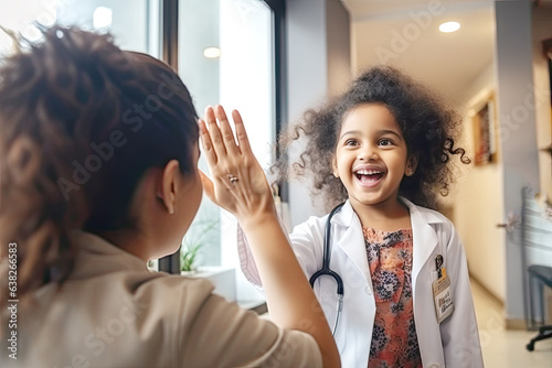 A child looks happy to meet a caregiver, give high five