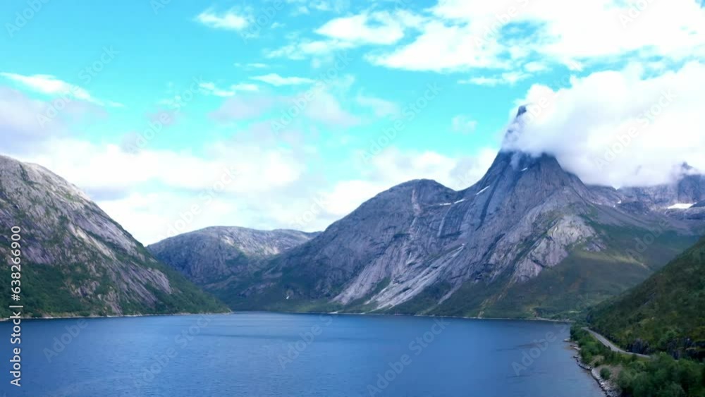 Cloud-capped Mountain Of Stetinden On Stefjord In Nordland, Norway. wide, hyperlapse Cloud-capped Mountain Of Stetinden On Stefjord In Nordland, Norway. wide, hyperlapse