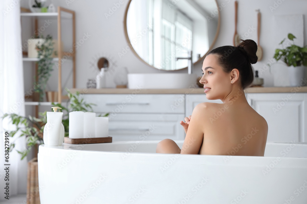 Young woman taking bath at home Young woman taking bath at home