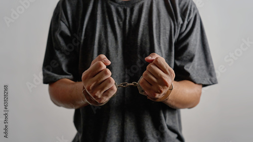 Foto concept of kidnap victim imprison arrest crime alleged offender man with hand shackle background