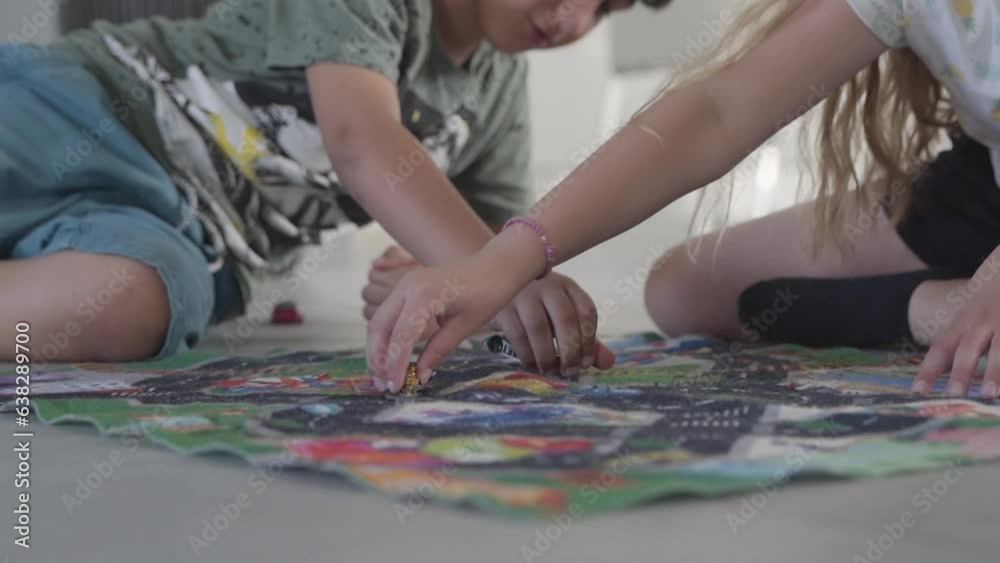 Children Playing With Toy Cars On Carpet With Road Design, On Living Room Floor Children Playing With Toy Cars On Carpet With Road Design, On Living Room Floor