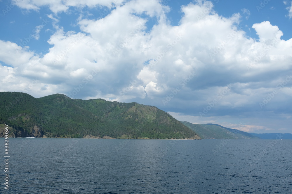Irkutsk region, Russia - 06.23.2018 : Lake Baikal and the coastal area with hills and different vegetation. Irkutsk region, Russia - 06.23.2018 : Lake Baikal and the coastal area with hills and different vegetation.