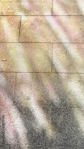 paper reflection of colored lights on the floor stone blocks, different iridescent shades, abstract backgrounds