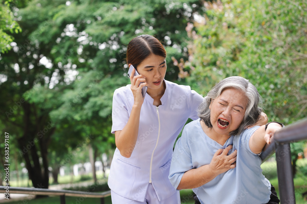 Senior adult women suffering heart attack and worried nurse making emergency call. Senior adult women suffering heart attack and worried nurse making emergency call.