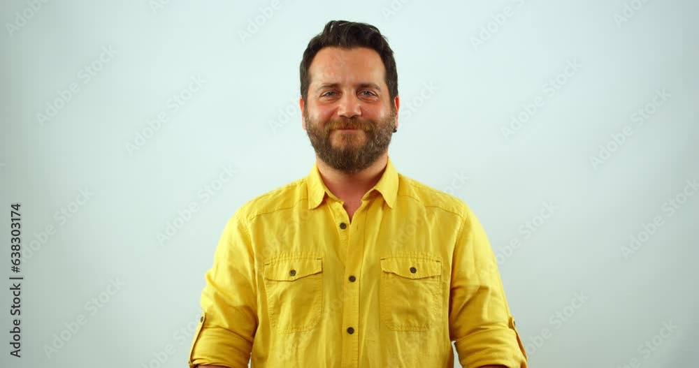 A middle-aged blonde man in a studio environment looks at the camera in slow motion and smiles funny A middle-aged blonde man in a studio environment looks at the camera in slow motion and smiles funny
