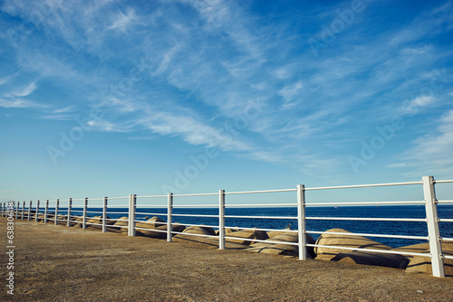 White Fences by the sea under the blue sky © Nooy_Film