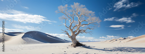 A dry, dead tree stands alone in the white desert of a barren expanse, under the blue sky. Generative AI