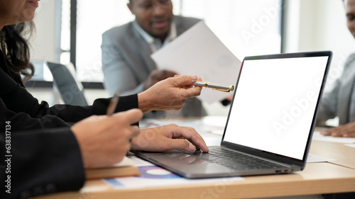 Close-up image of a professional senior Asian businesswoman using her laptop during the meeting