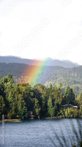 rainbow landscape with lake and mountains