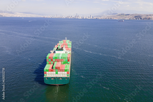 Container Cargo vessel cruising to terminal commercial port. Maritime logistics