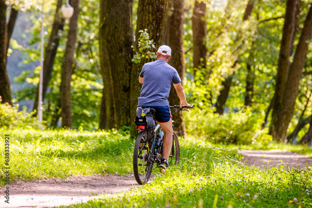 Cyclist ride on the bike path in the city Park
