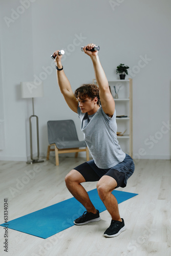 man dumbbells indoor home lifestyle training body health sport gray activity