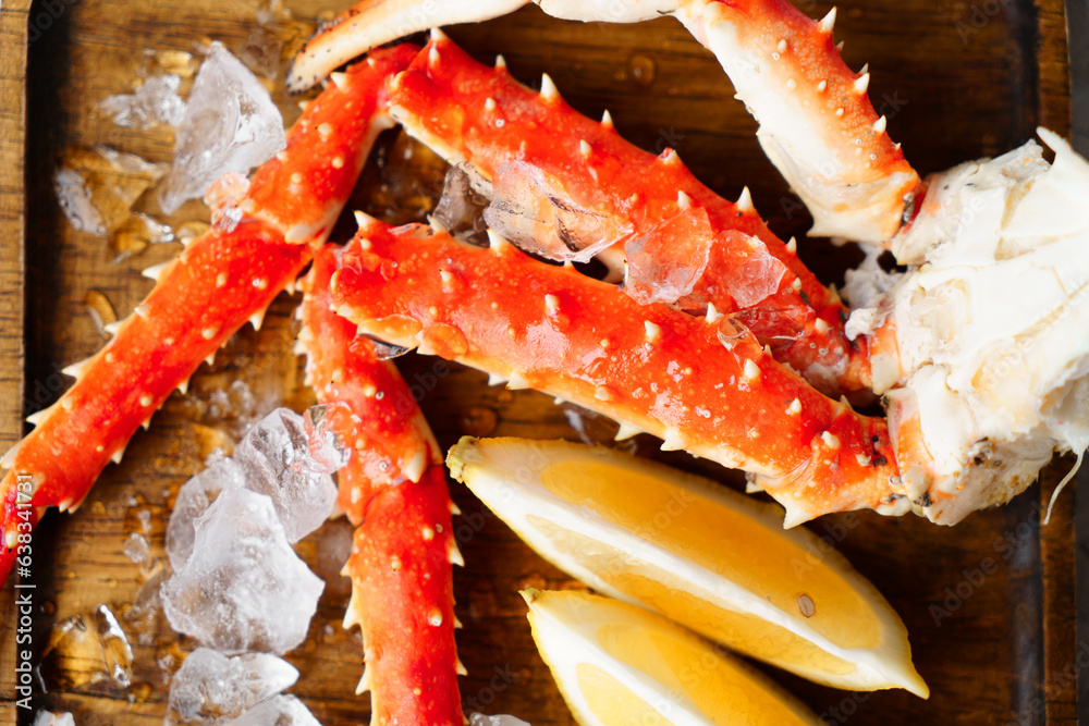 Crab meat. on a wooden plate with ice. Crab meat. on a wooden plate with ice.