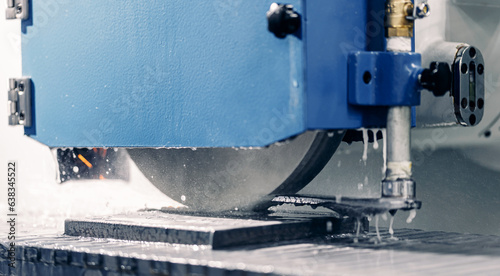 Concept metalworking industry, finish metal working on horizontal surface grinder machine with water and oil