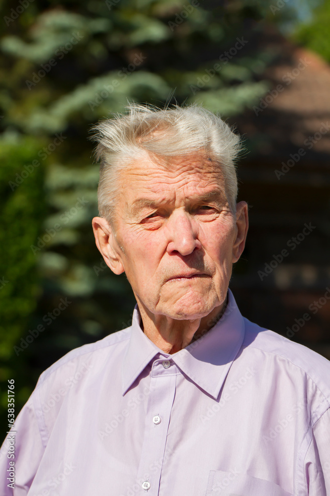 Portrait of an elderly man in the backyard. Portrait of an elderly man in the backyard.