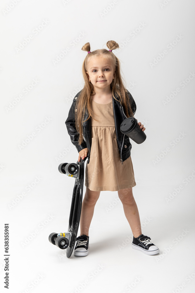 Stylish little girl child with skateboard over white background, Space for advertising Stylish little girl child with skateboard over white background, Space for advertising