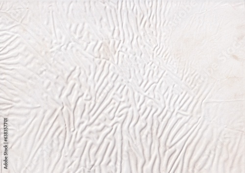 Wrinkled white cloth texture background. Textile with ripple effect. Crumpled blank fabric backdrop.