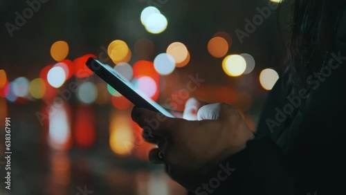 Isolated look on woman hands typing something on smartphone blurred background