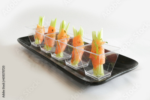 Fényképezés chef raw smoked salmon fish seafood wrapped with vegetable in cocktail cup canap