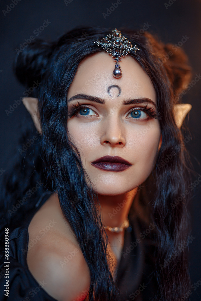 Beautiful black haired demon girl in seylor moon style. Dark elf girl in black dress on black background. 