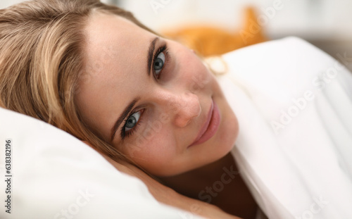 Young beautiful woman waking up in the morning concept