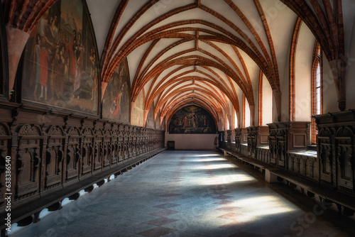 Side corridor with arches and beautiful decorations in Church of the Assumption of the Blessed Virgin Mary  Cathedral Basilica in Pelplin  Poland