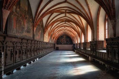 Side corridor with arches and beautiful decorations in Church of the Assumption of the Blessed Virgin Mary, Cathedral Basilica in Pelplin, Poland