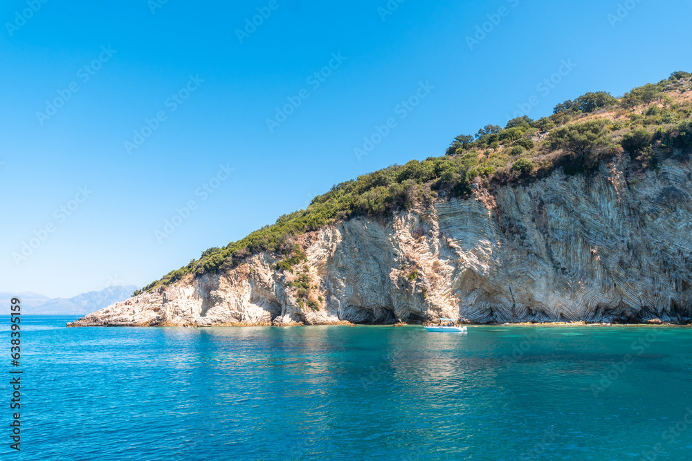  Gremina beach seen from the boat on the Albanian riviera near Sarande, turquoise sea water