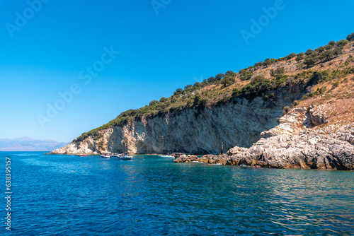 Gremina beach seen from the boat on the Albanian riviera near Sarande, turquoise sea water