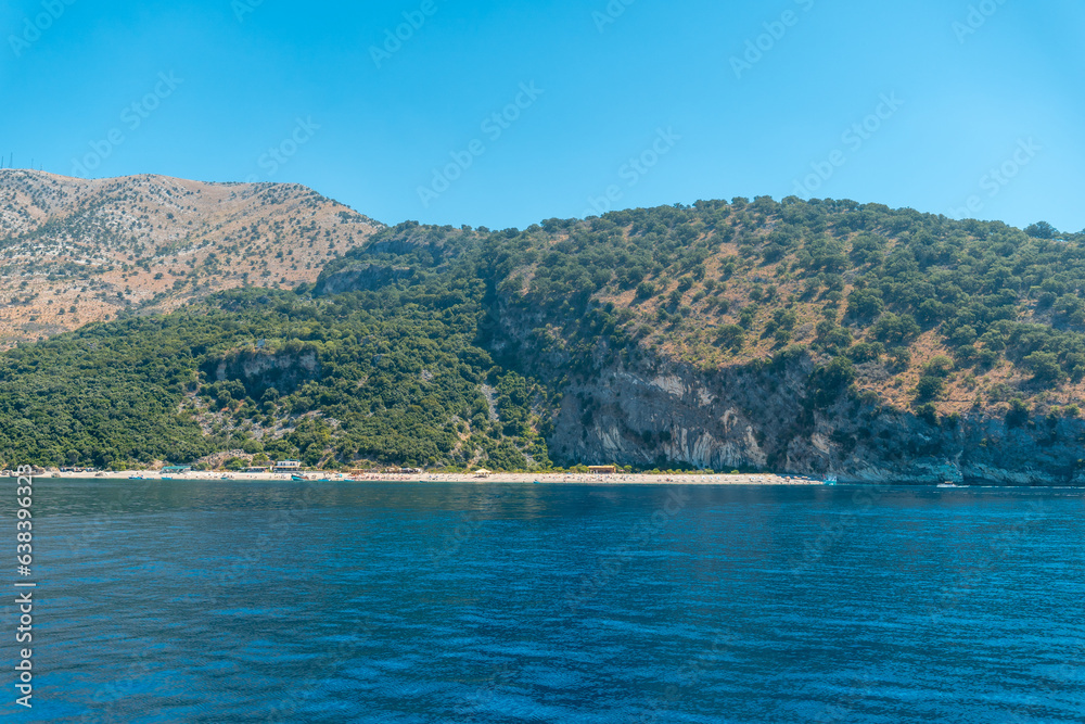 Obraz premium Kroreza or Krorez beach seen from the boat on the Albanian riviera near Sarande and its turquoise waters, Albania