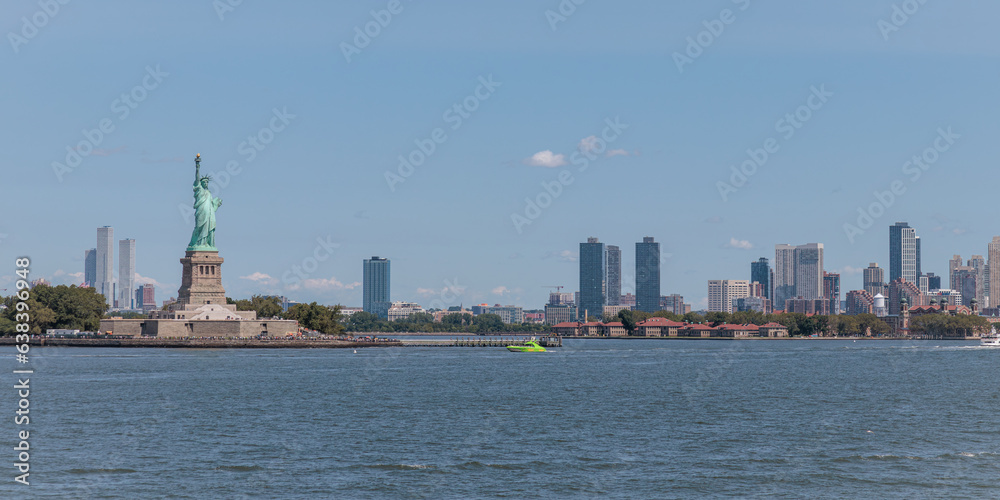 Statue of Liberty, Panorama of Jersey City, USA, sunny day, copy space