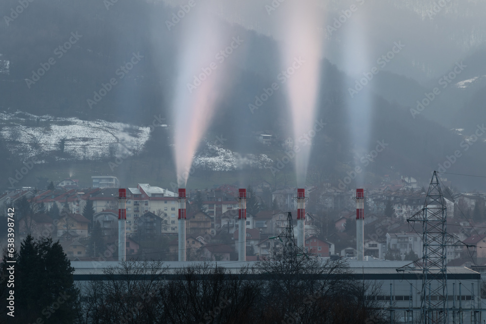 Smoke coming out of chimneys of heating plant at evening, Borik