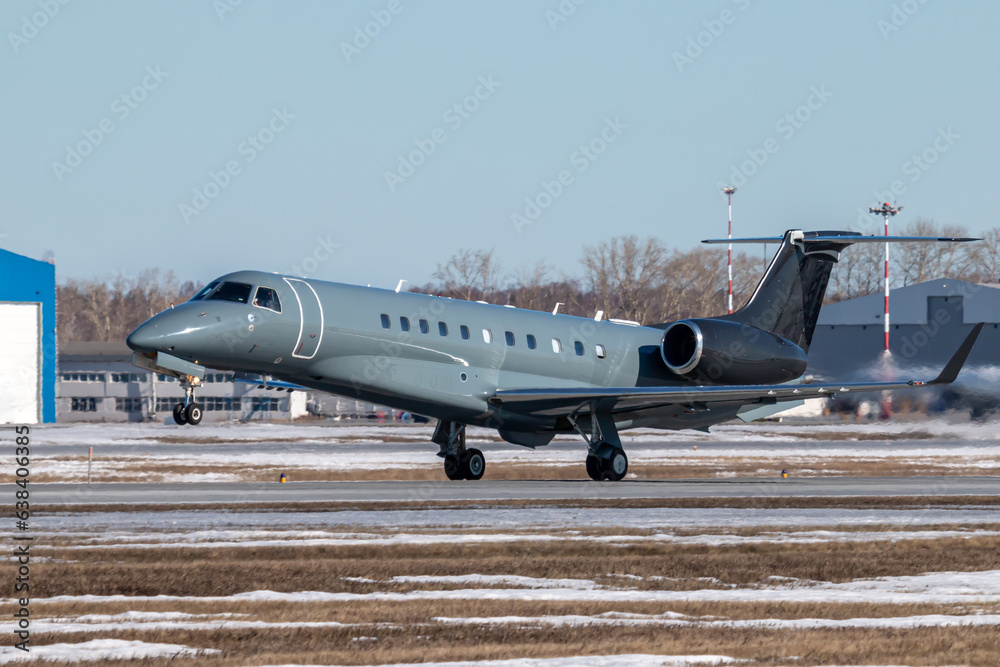 Takeoff of a business jet at a winter airport Takeoff of a business jet at a winter airport