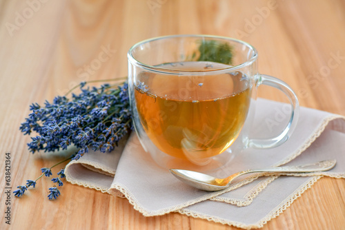 Fresh delicious tea with lavender and lavender flowers on a wooden table