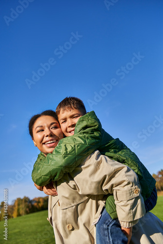joyous african american mother having fun with son, love and family bonding concept, diversity