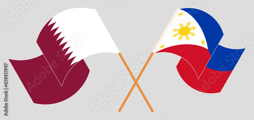 Crossed and waving flags of Qatar and the Philippines