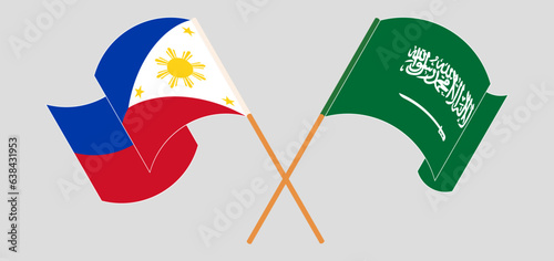 Crossed and waving flags of Saudi Arabia and the Philippines