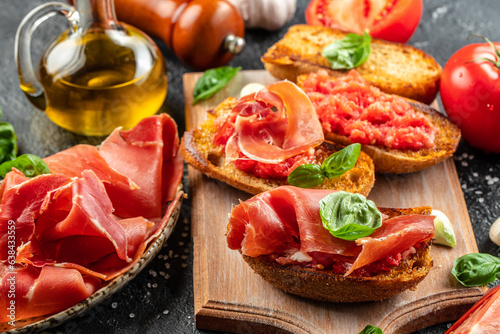Toast with tomato and Olive oil and jamon ham, traditional Spanish breakfast photo