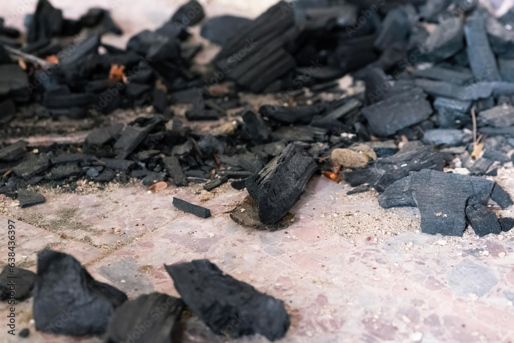 black charcoal on a floor black charcoal on a floor