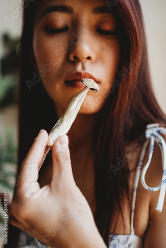 woman looking at mushroom