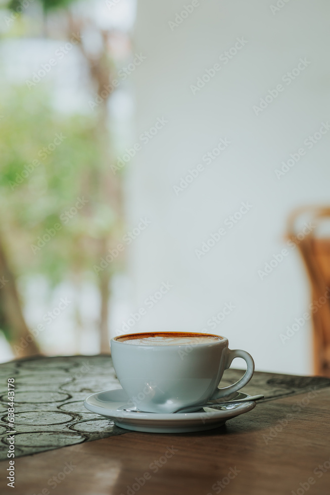 Cup of latte on wooden table in cafe shop Cup of latte on wooden table in cafe shop