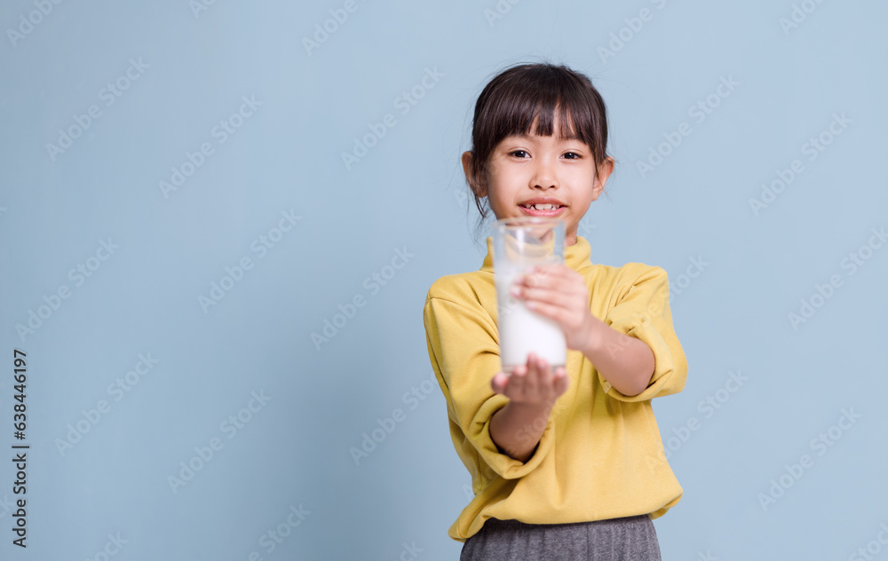 A little girl is drinking milk and very happy. A little girl is drinking milk and very happy.