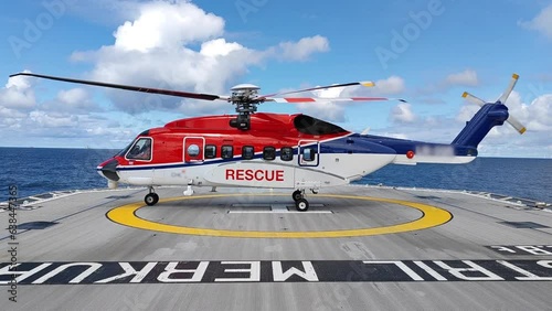 Air-sea rescue operations. Red rescue helicopter and Oil Tanker Ship . rescue team. The Coast security. The accident on the water. Ship have Emergency Accident. Training air sea recue operations. 