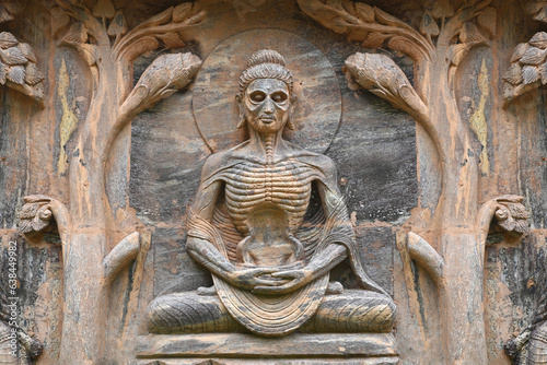 Stone statue of buddha at Mahabodhi Temple Complex in Bodh Gaya, India.Buddha sculpture tells the story of the Buddha's history.