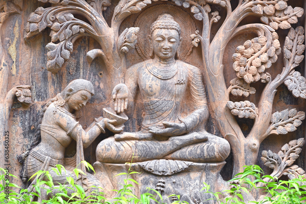 Stone statue of buddha at Mahabodhi Temple Complex in Bodh Gaya, India.Buddha sculpture tells the story of the Buddha's history.