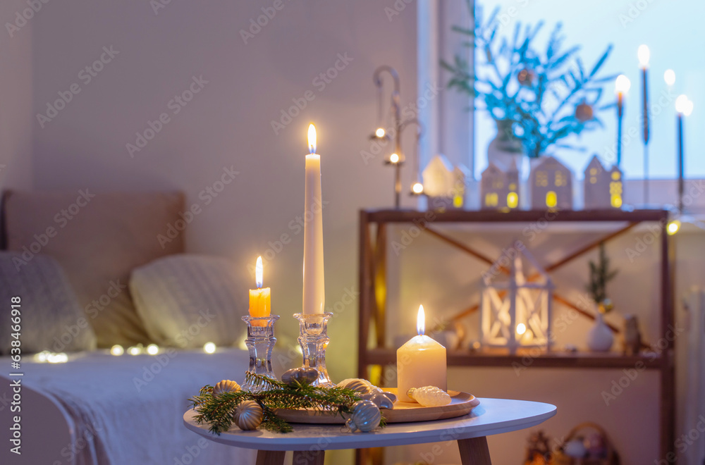 beautiful white room with christmas decor with burning candles beautiful white room with christmas decor with burning candles