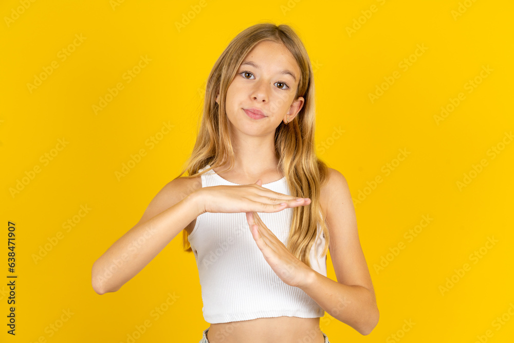 Young handsome man standing over yellow studio background being upset showing a timeout gesture, needs stop, asks time for rest after hard work, Young handsome man standing over yellow studio background being upset showing a timeout gesture, needs stop, asks time for rest after hard work,