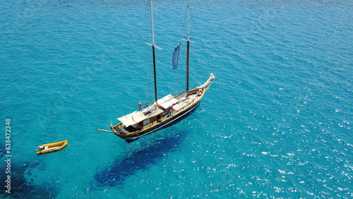 Yacht, sailing in Croatia and sun on ocean holiday, relax in freedom and nature with clean blue water from above. Boat vacation, travel in summer and tropical cruise on sea adventure with island fun.