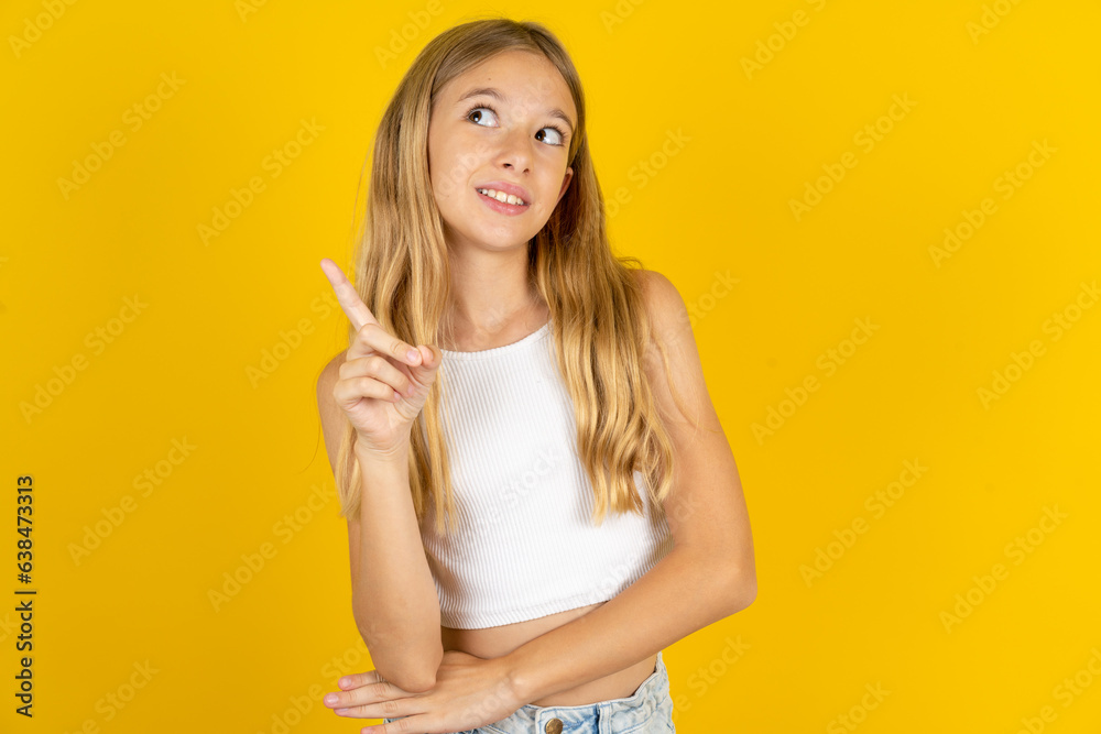 Photo of attractive Beautiful teen girl direct finger empty space cheap dentistry Photo of attractive Beautiful teen girl direct finger empty space cheap dentistry