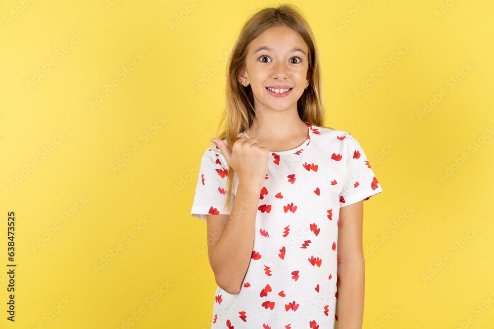 Lovely Beautiful teen girl pointing aside with forefinger, showing at copy space having news about bargains Lovely Beautiful teen girl pointing aside with forefinger, showing at copy space having news about bargains